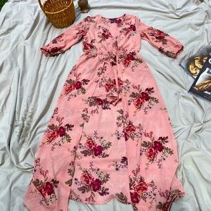 Pink floral shorts romper with flowing wrap around back.
